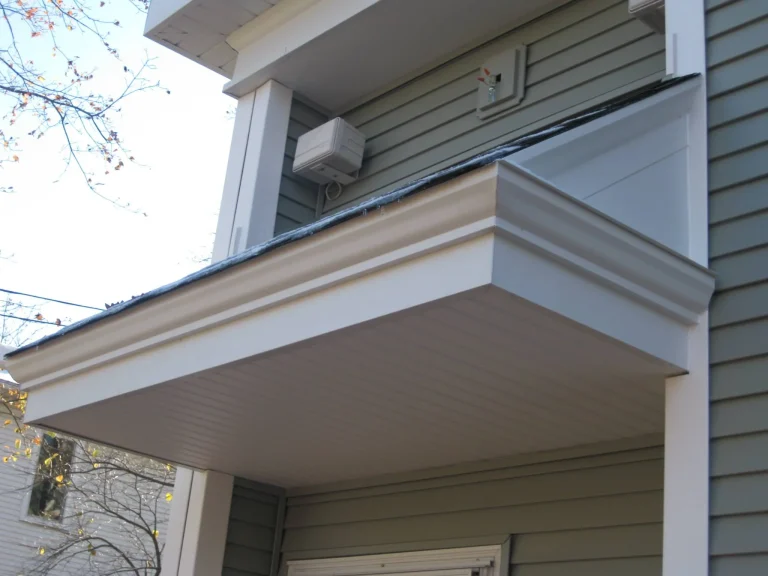 seamless gutter on house with gray siding installation