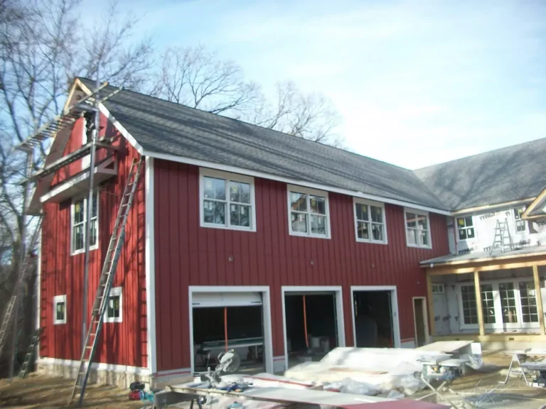 house with a red siding installation