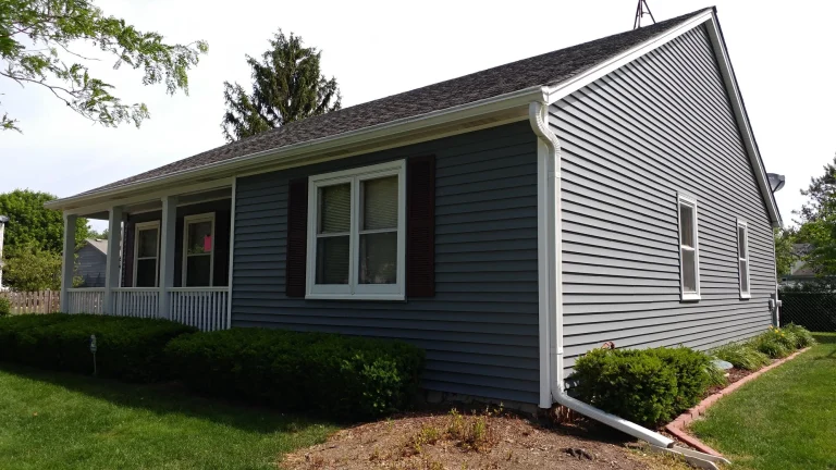 side view of a house with a new siding installation